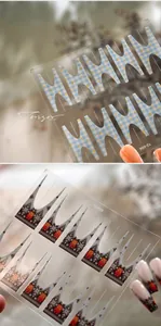 Detailed view of French-style self-adhesive nail stickers featuring bear and plaid patterns