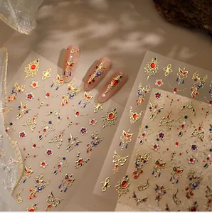 Close-up of New Chinese style nail stickers featuring golden phoenix and floral patterns