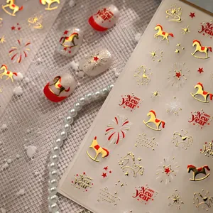 New Year nail art stickers featuring rocking horse, fireworks, and gold star patterns