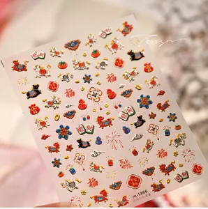 Detailed macro view of 3D embossed Chinese New Year nail stickers with gold pony and lucky icons