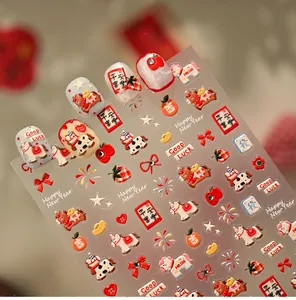 Détails de stickers nail art 3D avec motifs festifs rouges, chats porte-bonheur et feux