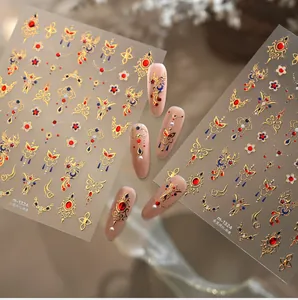 Macro detail of 3D gold phoenix nail stickers with vintage embroidery texture