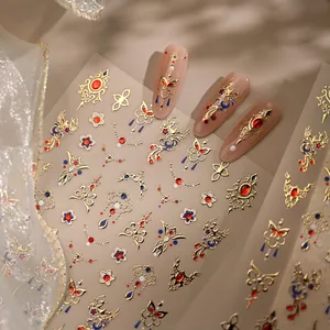 3D embossed nail stickers featuring gold phoenix patterns and butterfly embroidery designs