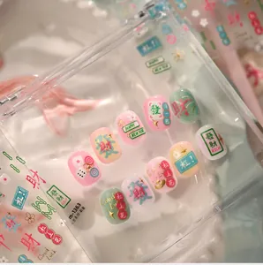 Detail view of Mahjong themed press-on nails with 3D embossed characters and glitter finish