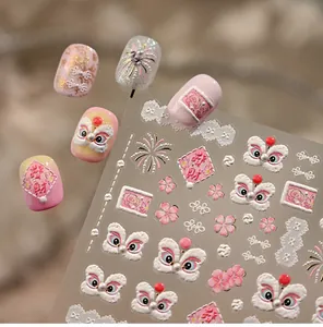 Detail of 3D embossed nail stickers featuring pink lion dance and floral patterns