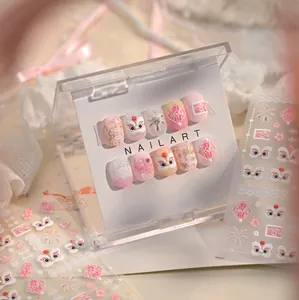 Detail of pink lion dance nail art stickers featuring cherry blossoms and lace accents