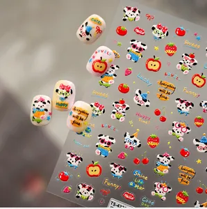 Detail view of cartoon panda and fruit nail stickers with decorative lettering for manicure