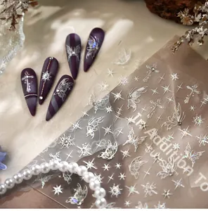 Detailed holographic laser nail stickers with butterfly and star patterns on purple nails