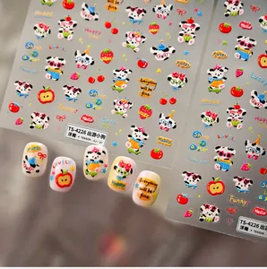 Detail of 3D embossed dog nail stickers showing cartoon patterns and 5D relief texture