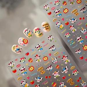 Detailed close-up of cute cartoon panda and fruit nail art stickers with finished tips