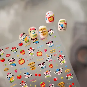 Detail of dog and fruit nail stickers showing cartoon patterns and inspirational text