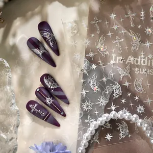 Purple matte laser butterfly nail stickers with silver cross and starburst designs