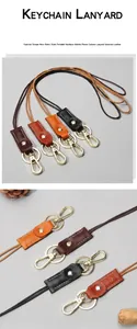 Close-up detail of genuine vegetable tanned leather lanyard with sturdy metal ring and clasp