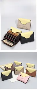 Detail of genuine leather elephant card holder showing multi-slot accordion style interior