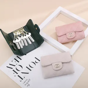 Elegant quilted caviar leather key pouch in green, pink and beige with metal rings