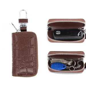 Brown textured leather car key case with zipper closure and metal spring hook