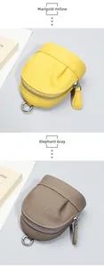 Close-up of litchi grain leather mini pouches in Marigold Yellow and Elephant Gray