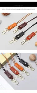 Detail of colorful vintage leather keychains with gold hardware and lobster clasps