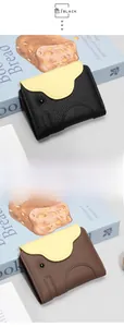 Detailed view of leather elephant card holder in black and dark khaki colors