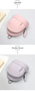 Close-up of pebble grain leather mini purses in light pink and mambo purple colors