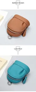 Detail of genuine leather mini purses in Golden Brown and Lake Blue with metal hooks