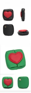 Detailed views of mini leather coin purses with red heart patches and metal ring hooks