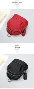 Detail view of red and black leather coin purses with litchi grain and metal hooks