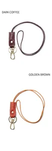 Detail of hand-woven leather lanyards in dark coffee and golden brown with metal hooks