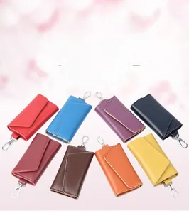 Multi-color leather key pouches in eight vibrant shades with metal spring hooks