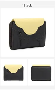 Close-up of elephant shaped leather card holder with black and yellow contrast detail