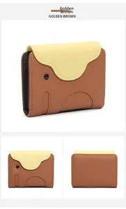 Detail of golden brown elephant leather card holder featuring pebble texture and stitching