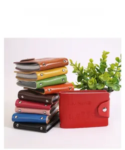 Close-up of leather driver license holders in multiple colors with snap button closure