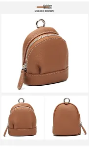 Three-angle view of golden brown leather mini backpack coin purse with silver metal clasp
