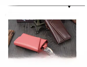 Detail of leather key case showing large capacity and multi-card slots in pink and brown