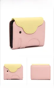 Detailed views of a light pink elephant-shaped leather card holder with litchi texture