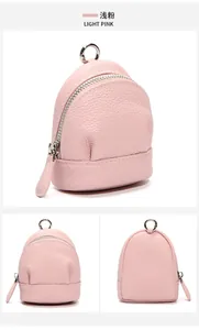 Detail view of mini light pink leather coin purse with silver hardware and ring buckle