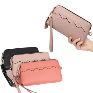 Women's genuine leather clutch wallet with wrist strap and scalloped flap detail