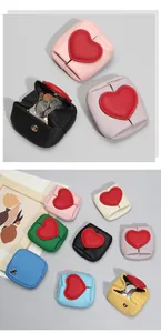 Detail of colorful mini leather coin purses with heart decor and gold metal snap buttons