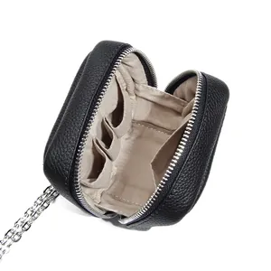 Mini black lychee leather makeup pouch with silver chain strap and multiple inner pockets