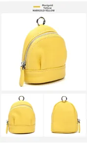Marigold yellow mini backpack coin purse in pebbled leather with silver zipper details