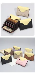 Detail of genuine leather elephant card holder with accordion slots and colorful designs