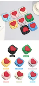 Macro detail of various colorful genuine leather mini heart coin purses with lychee grain texture