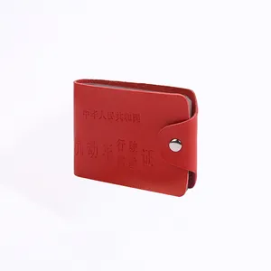 Red genuine leather driver license holder with secure metal snap button and embossed text