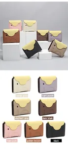 Close-up of cute elephant-shaped leather card holders in various vibrant colors