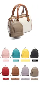 Detailed view of mini leather coin purses in various colors with metallic ring clips