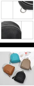 Detailed view of genuine leather mini coin purses with lychee texture and metal carabiner