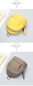 Detail of pebbled cowhide leather coin purses in marigold yellow and elephant gray