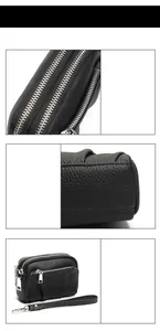Detailed view of black litchi leather coin purse with three zippers and wrist strap