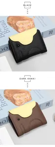 Detailed view of genuine leather elephant card wallets in black and dark khaki colors