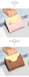 Detail of elephant-shaped leather card wallet with pebbled texture in pink and brown